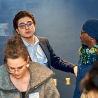 International Anchor Allies Winter 2026 First Mixer - 2 student a in conversation behind a female participant